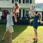 Tallahassee Family playing with their kids in the yard