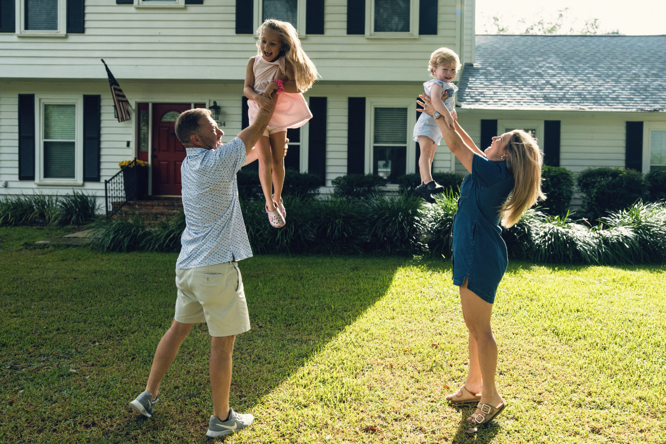 Tallahassee Family playing with their kids in the yard